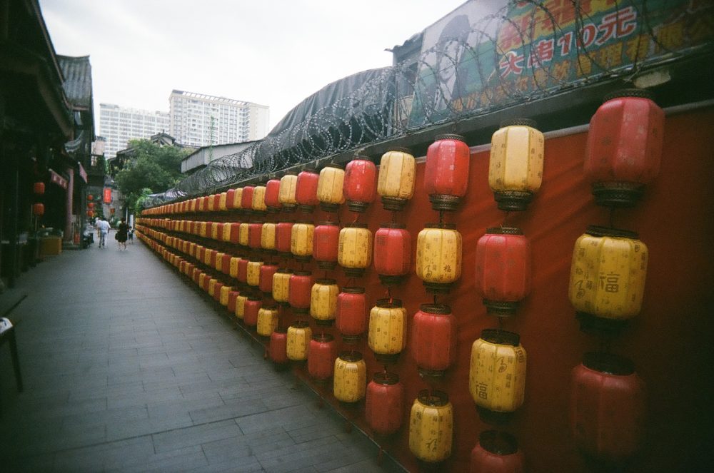 lanterns & razor wire outside Chengdu People's Park